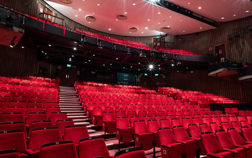 Image of red auditorium seats.